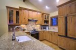 Fully Stocked Kitchen with Granite Counters